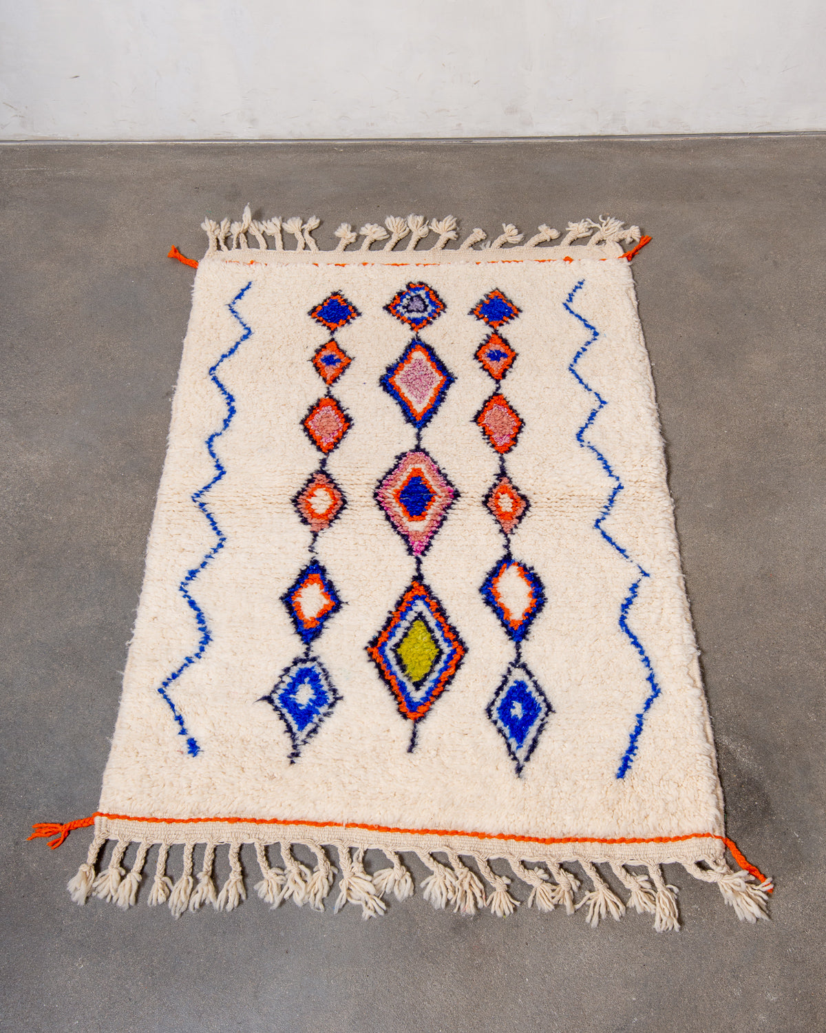 Modern, designer, handcrafted Berber rug from Morocco. Beniourain carpet with beautiful colours and patterns and fluffy wool texture.